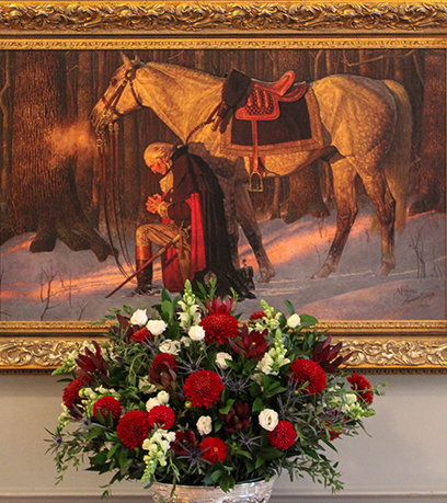 George Washington arrodillado mientras reza